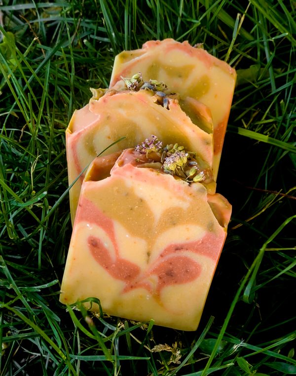 Summer Solstice Goat Milk Soap sitting in the grass